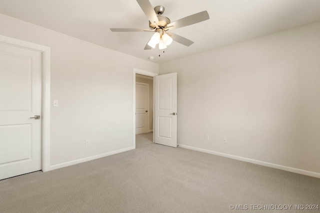 unfurnished bedroom with ceiling fan and light carpet