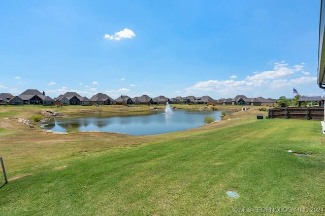 water view with nearby suburban area and fence
