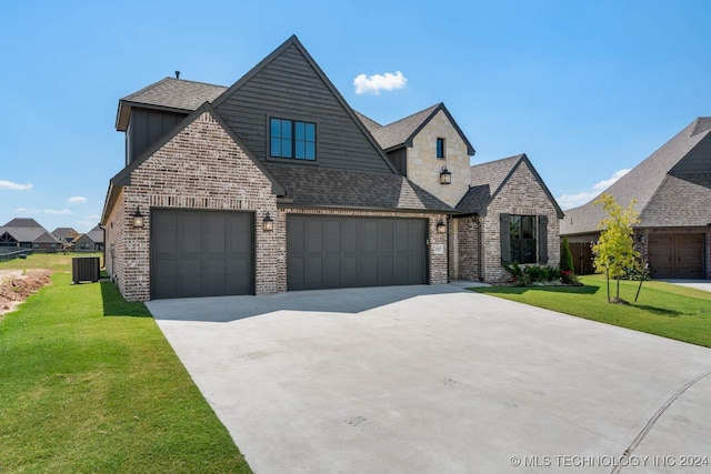 view of front facade featuring driveway, cooling unit, brick siding, and a front lawn