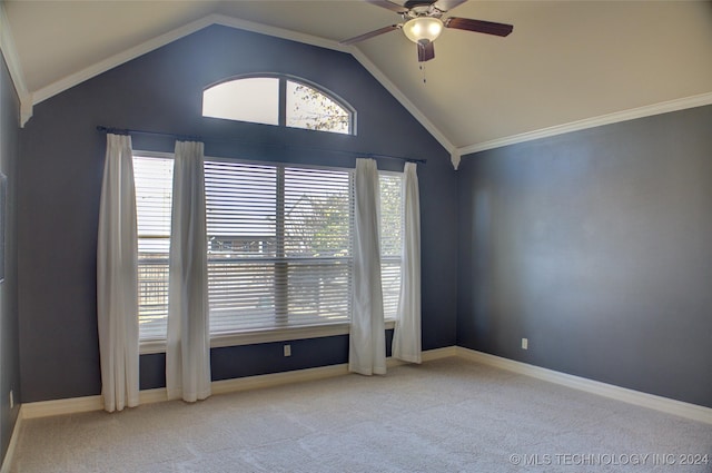 unfurnished room with ceiling fan, light colored carpet, ornamental molding, and vaulted ceiling