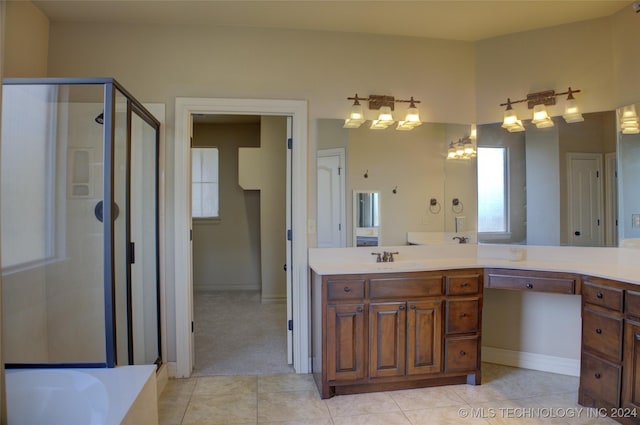 bathroom featuring tile patterned flooring, vanity, independent shower and bath, and a notable chandelier