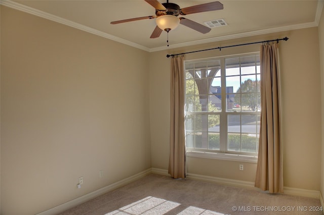 unfurnished room with light carpet, ceiling fan, and ornamental molding