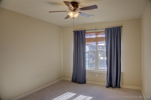 carpeted empty room with ceiling fan