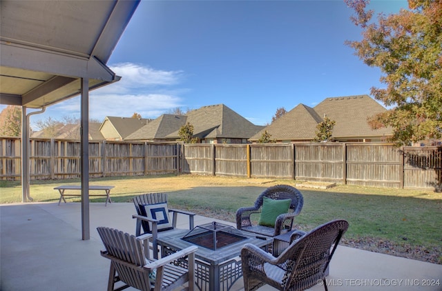 view of patio featuring an outdoor fire pit