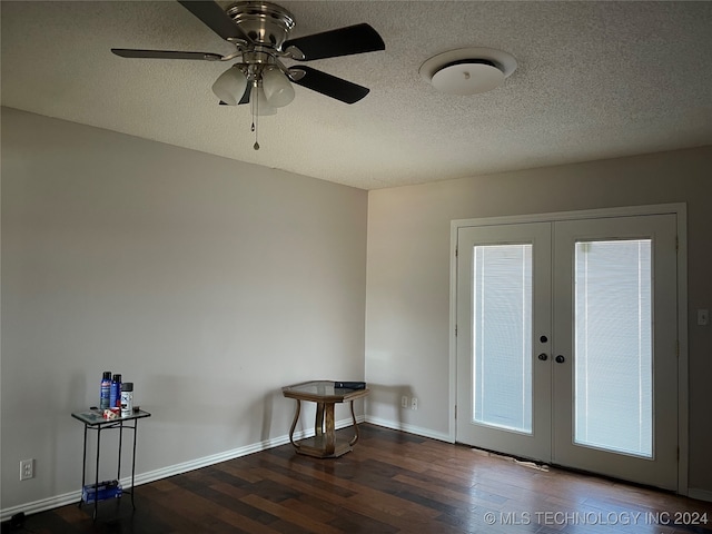 doorway to outside featuring a textured ceiling, dark hardwood / wood-style floors, ceiling fan, and french doors