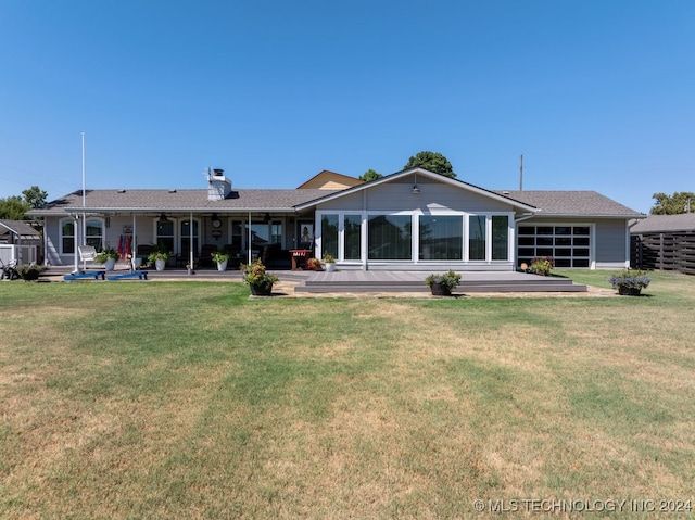 back of property featuring a patio area and a yard