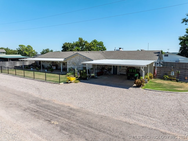 ranch-style home featuring a carport