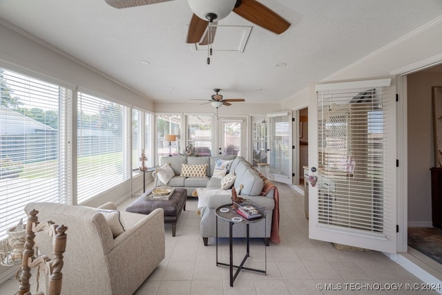 tiled living room with ceiling fan