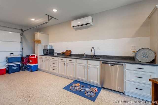 kitchen with sink, white cabinets, stainless steel dishwasher, and a wall mounted AC