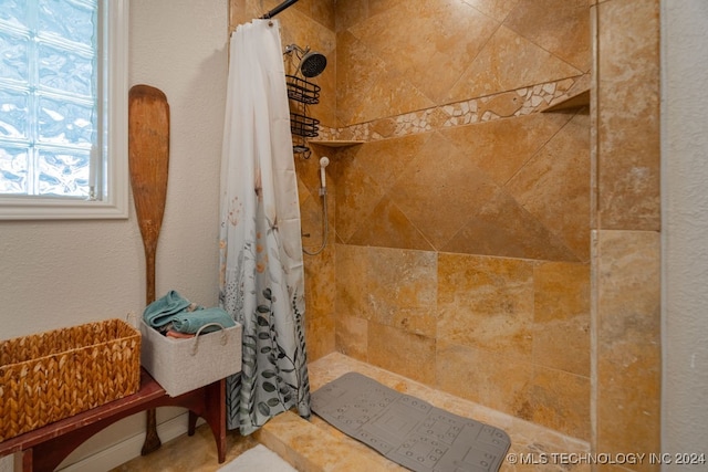 bathroom with a shower with curtain