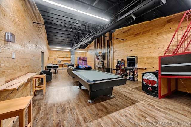 playroom featuring hardwood / wood-style floors, billiards, and wood walls