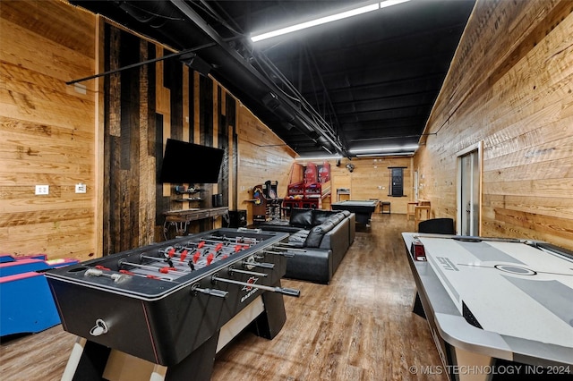 playroom with wood walls, billiards, and wood finished floors