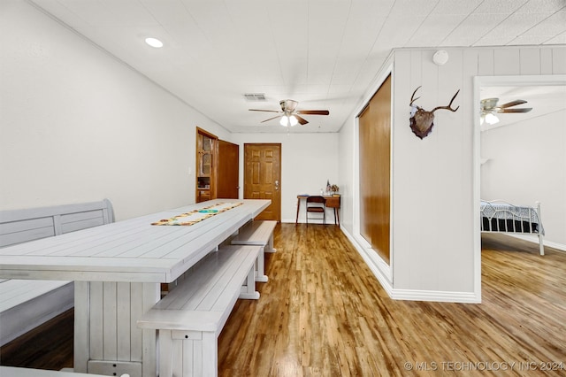 dining area featuring light hardwood / wood-style flooring and ceiling fan