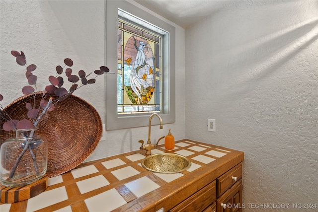 bathroom featuring a healthy amount of sunlight and vanity