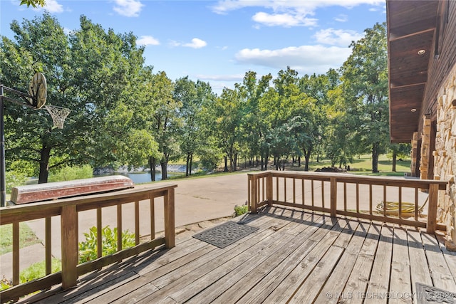 wooden deck with a water view