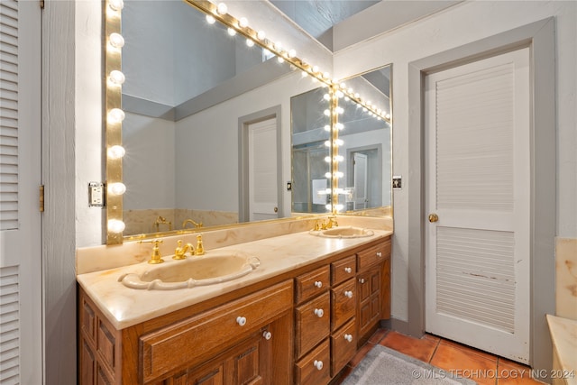 bathroom featuring tile patterned flooring and vanity