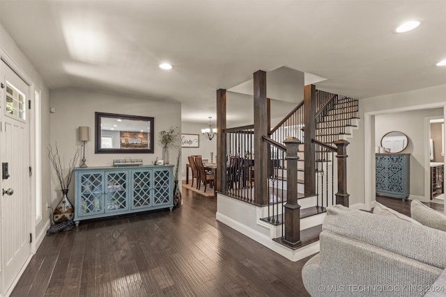 interior space with dark hardwood / wood-style flooring and a chandelier