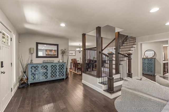 interior space with dark wood-style floors, recessed lighting, a notable chandelier, and stairs