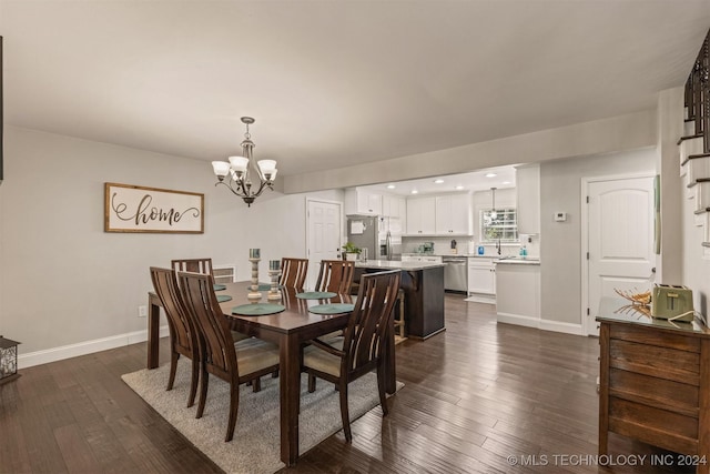 dining space featuring recessed lighting, dark wood-style flooring, baseboards, and an inviting chandelier