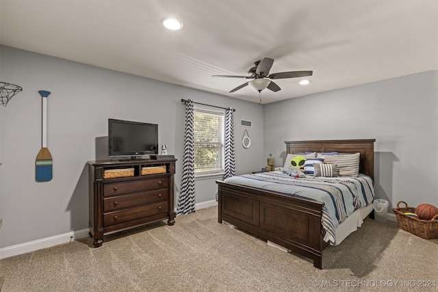 bedroom with ceiling fan and light colored carpet