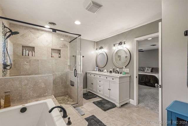 bathroom featuring tile patterned floors, independent shower and bath, and vanity