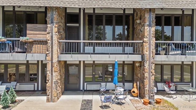 rear view of property with a balcony