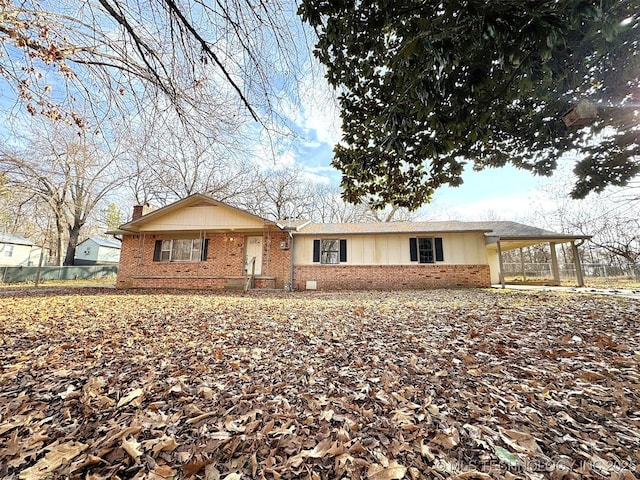 ranch-style house with a carport