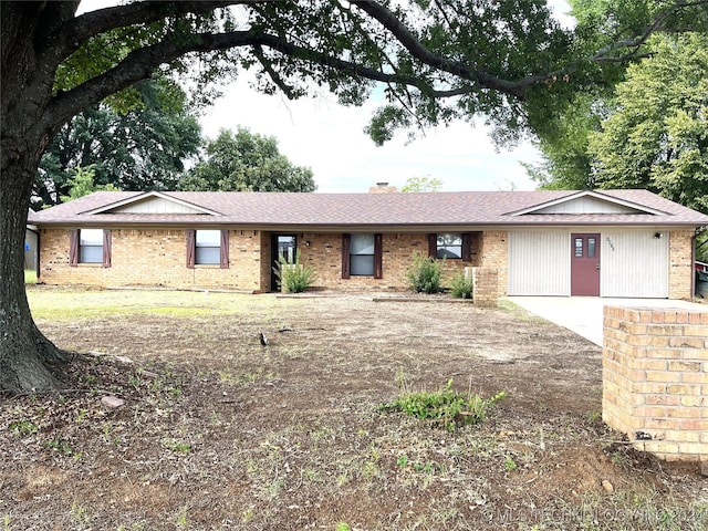 2912 Michelle, Durant, OK 74701 - single story home featuring brick siding, a shingled roof, and a chimney