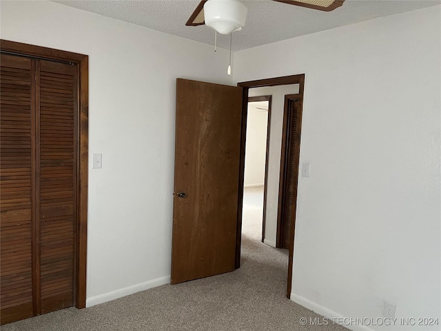 2912 Michelle, Durant, OK 74701 - unfurnished bedroom with carpet floors, baseboards, a closet, and ceiling fan