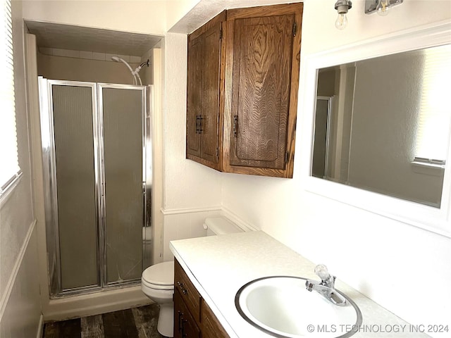 2912 Michelle, Durant, OK 74701 - bathroom with toilet, a shower stall, vanity, and wood finished floors