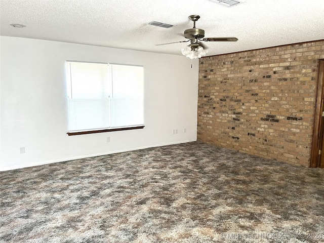 2912 Michelle, Durant, OK 74701 - carpeted empty room with brick wall, visible vents, a textured ceiling, and ceiling fan