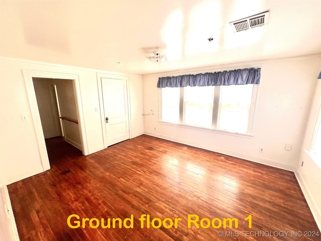 empty room featuring wood-type flooring