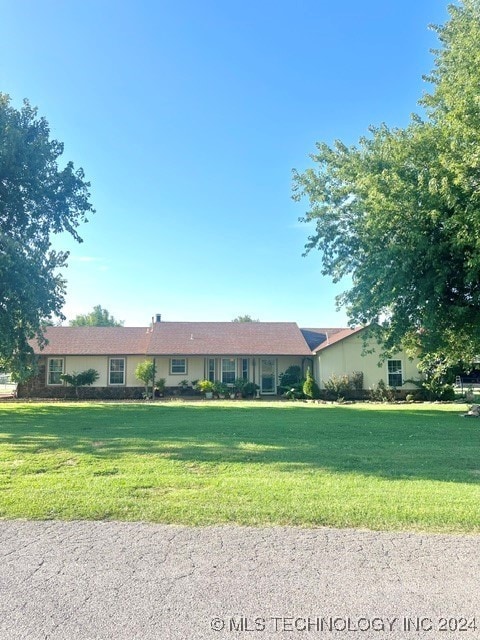 ranch-style house with a front yard