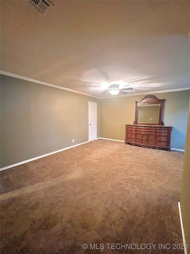 unfurnished bedroom featuring carpet flooring, ceiling fan, and ornamental molding