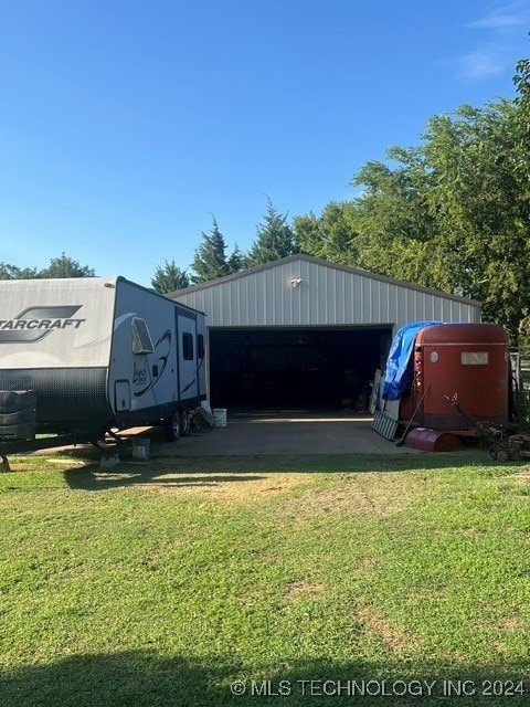 view of outdoor structure featuring a yard