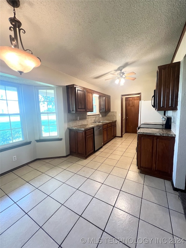 kitchen featuring stainless steel dishwasher, pendant lighting, ceiling fan, and a textured ceiling