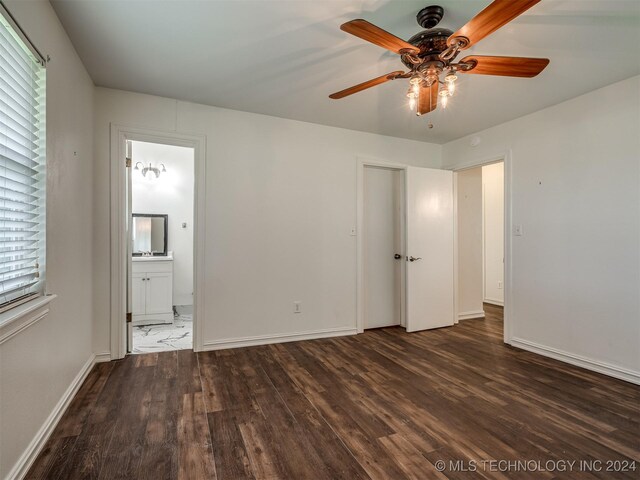 unfurnished bedroom with ceiling fan, connected bathroom, and wood-type flooring