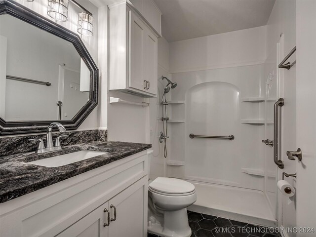 full bathroom with shower / bathing tub combination, tile patterned flooring, vanity, and toilet