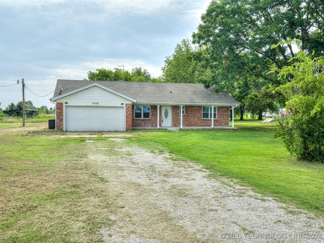 ranch-style house with a front lawn and a garage