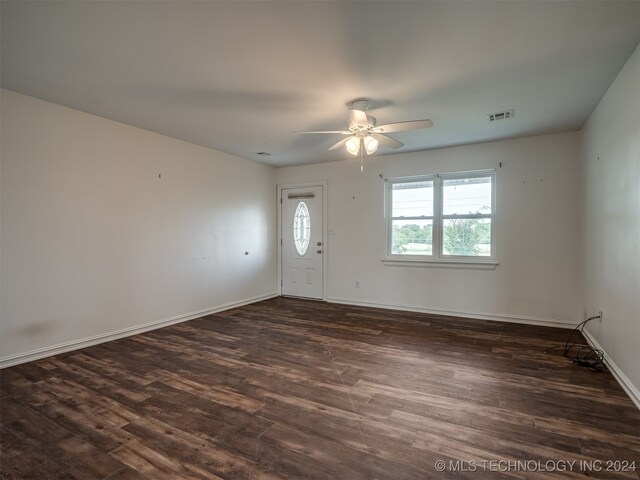 empty room with ceiling fan and hardwood / wood-style floors