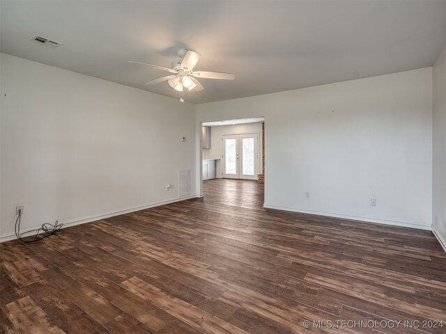 spare room with ceiling fan, wood-type flooring, and french doors