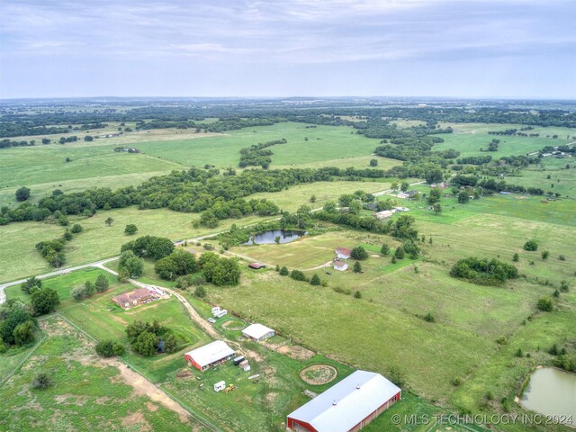 aerial view with a rural view and a water view