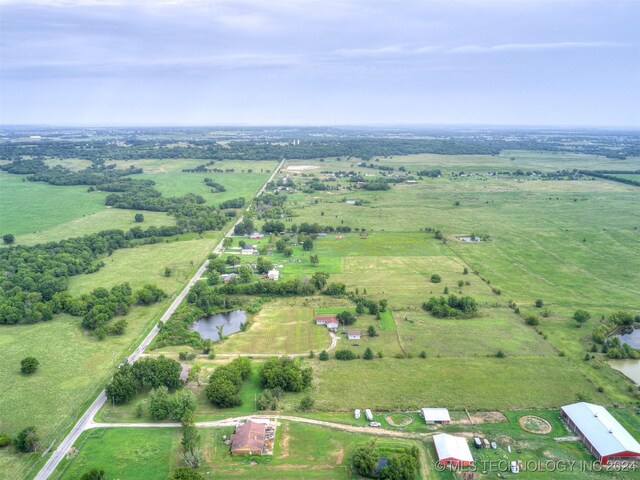 drone / aerial view with a rural view and a water view