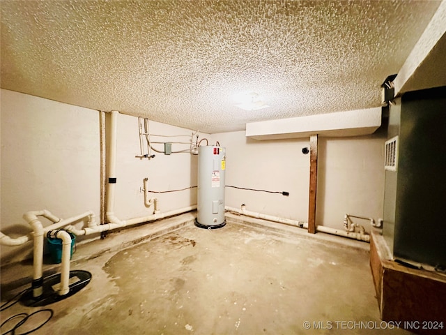 basement with electric water heater and a textured ceiling