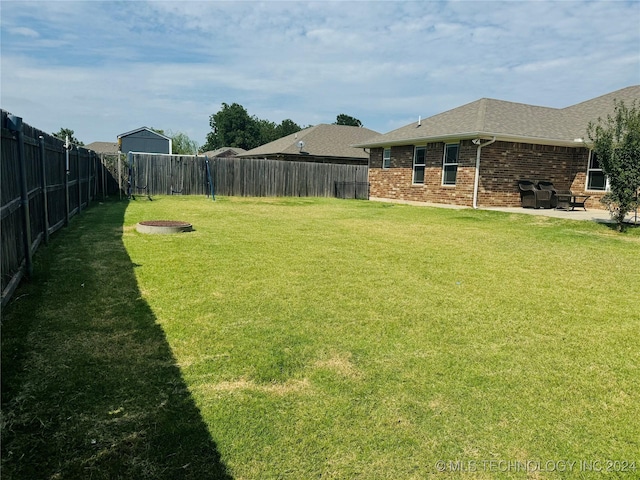 view of yard with a patio and a fenced backyard