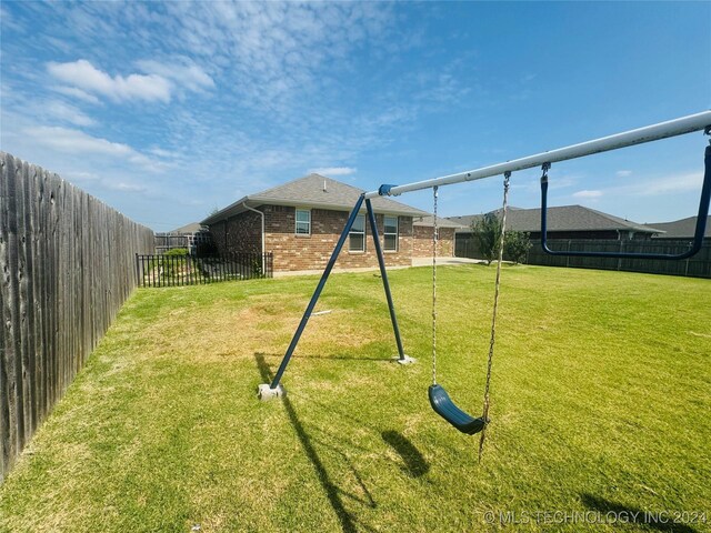 view of jungle gym featuring a yard