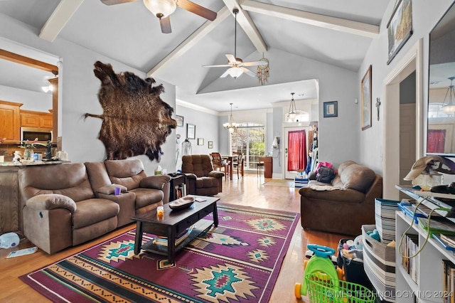 living area featuring light wood-style floors, lofted ceiling with beams, and ceiling fan with notable chandelier