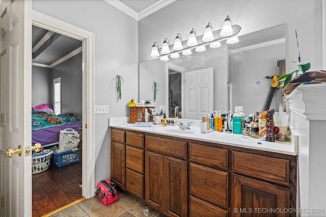 bathroom with ornamental molding, tile patterned flooring, connected bathroom, and vanity