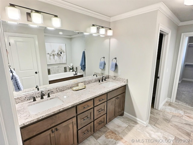 bathroom with double vanity, crown molding, and a sink