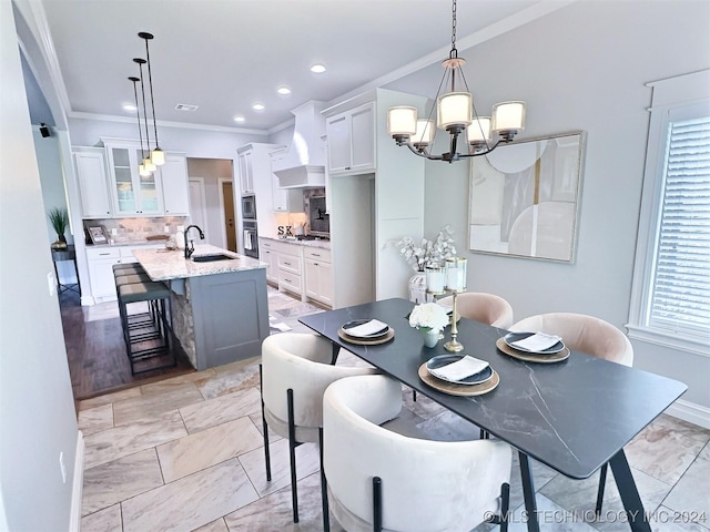 dining room with baseboards, ornamental molding, recessed lighting, and a notable chandelier